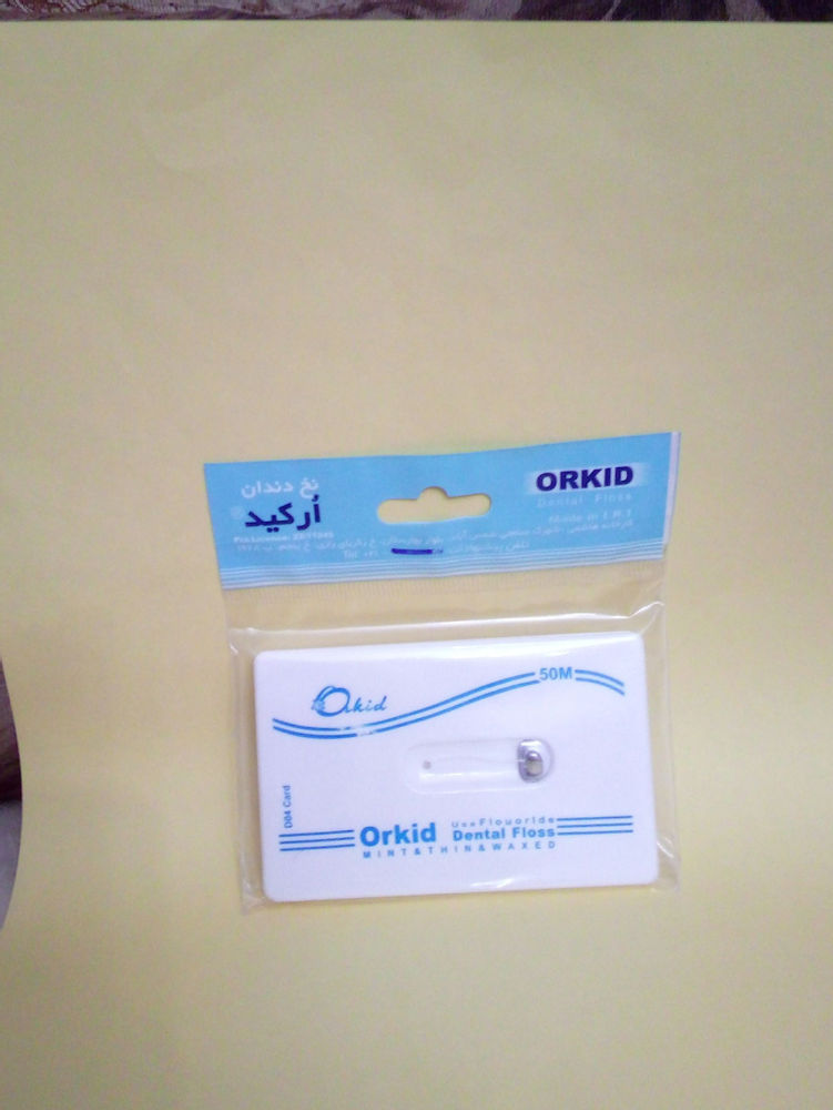 بهداشتی  آرایشی رامین،آرش نخ دندان کتابی ارکیدمدل جالب حمل آسان داخل کیف وهرمکان نخ ۵۰متر